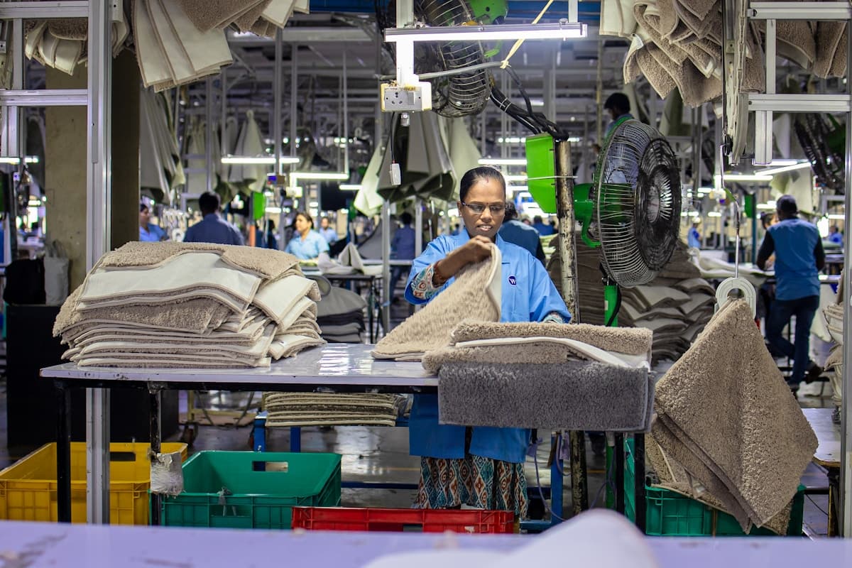 Industrial technician working on factory shopfloor with practical skills