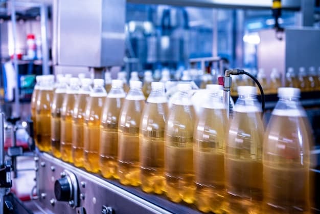 Conveyor belt with bottles for juice or water at a modern beverage plant