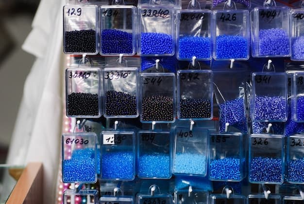Colorfull glass beads batches in plastic bags for beadwork in craft shop