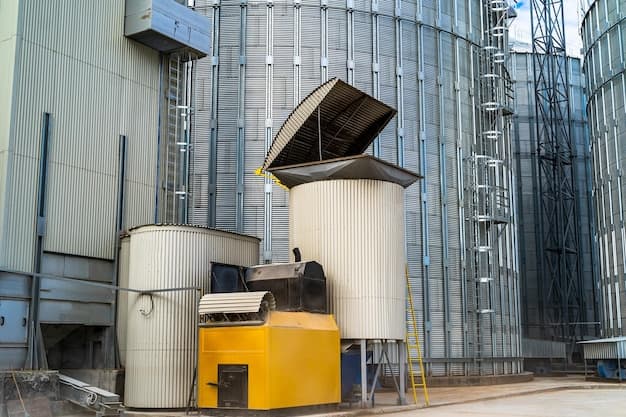 Big metal tanks at granary Individual cisterns near industrial steel silo Elevators in industrial zone Closeup