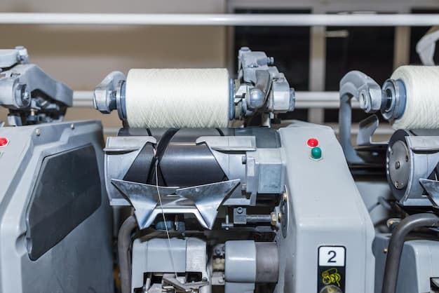Cotton Yarn Production in a Textile Factory Textile fabric manufacturing machines in work Row of automated machines for yarn manufacturing Modern Textile PlantSelective focus